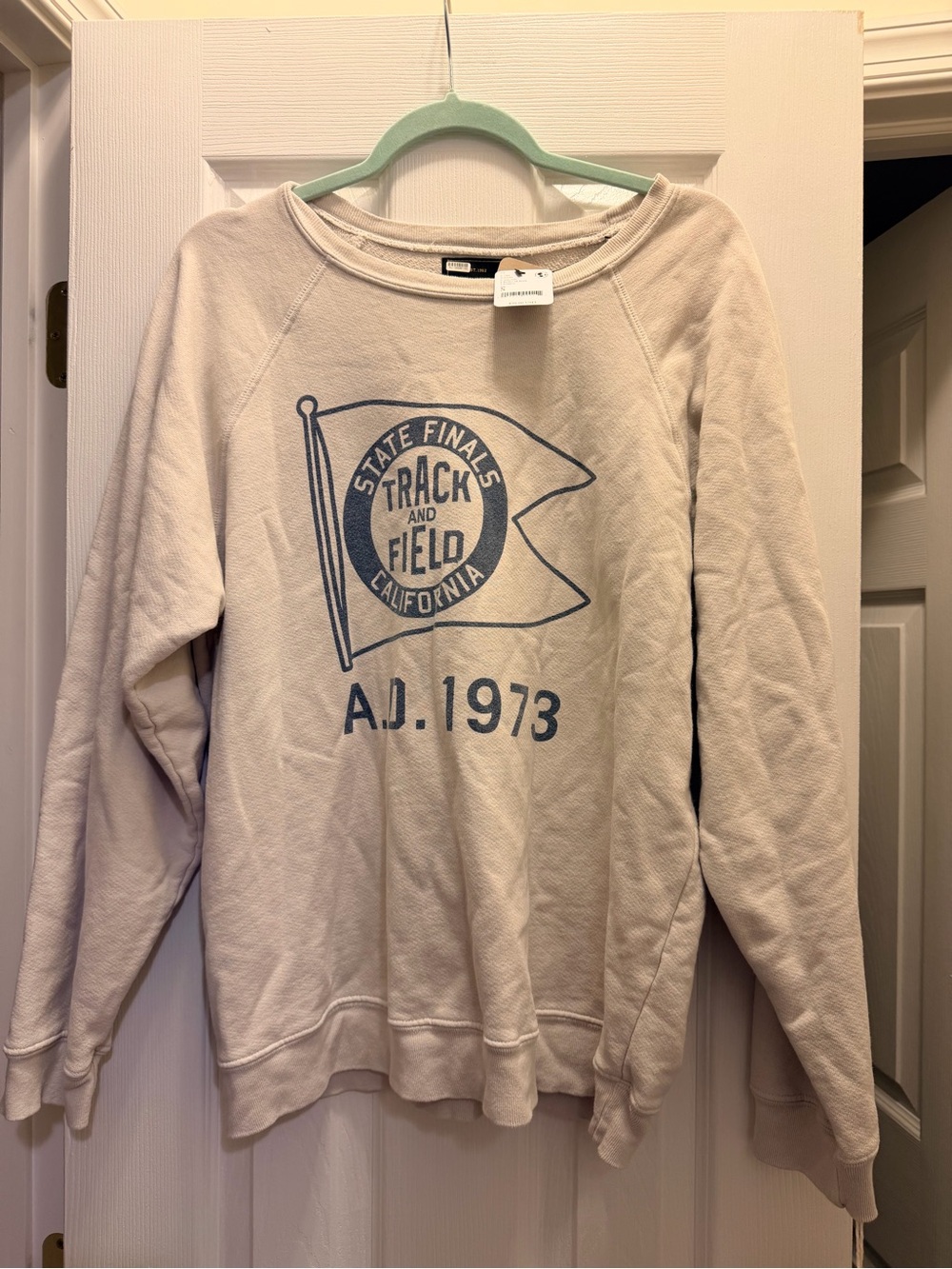 Original Retro Brand Cream Sweatshirt with Blue Track & Field Graphic